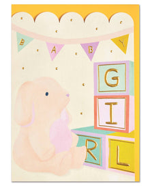  Baby shower card with a baby girl illustration and alphabet blocks spelling 'Girl'.