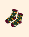 Pair of socks with fox pattern on a beige background