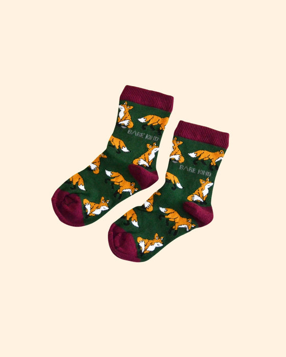 Pair of socks with fox pattern on a beige background