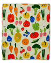 Quilt with colorful pattern of cartoon fruits and vegetables on a beige background