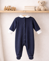 Navy baby onesie with white collar on a white background