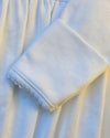 Close-up of white fabric with a textured edge