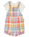 Children's outfit with a white t-shirt and colorful plaid overalls on a white background