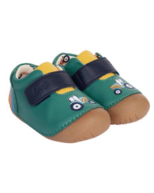  Green baby shoes with cartoon design on a white background