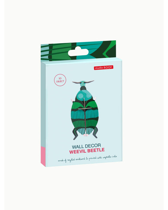 Packaging of wall decor with a weevil beetle design on a light blue background